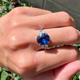 Oval Blue Sapphire and Diamond Three Stone Ring