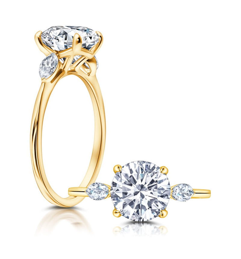 Three Stone Engagement Ring Featuring Marquise Side Diamonds