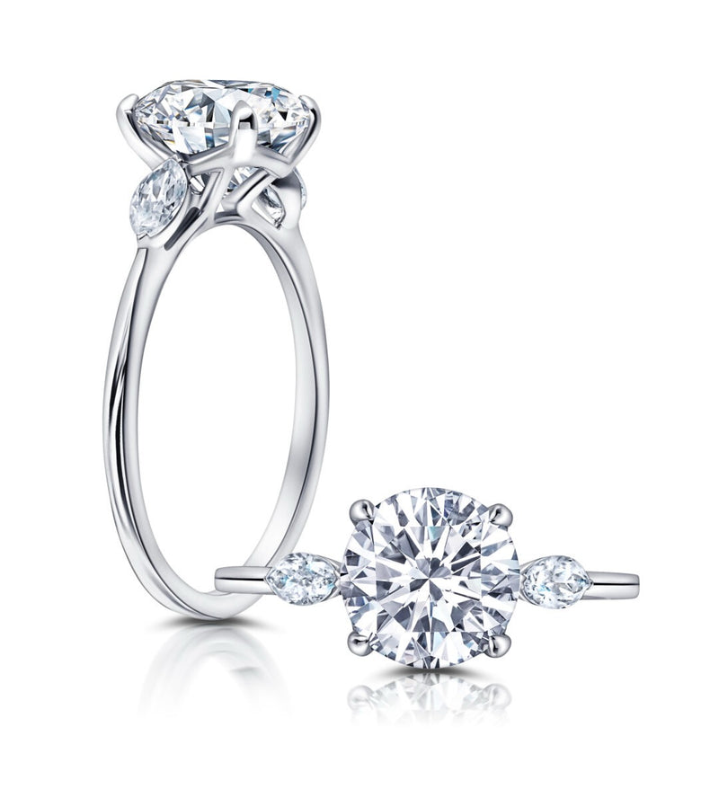 Three Stone Engagement Ring Featuring Marquise Side Diamonds