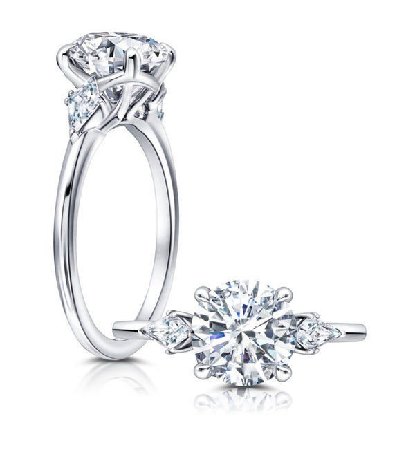 Classic Three Stone Engagement Ring Featuring Two Kite Diamonds