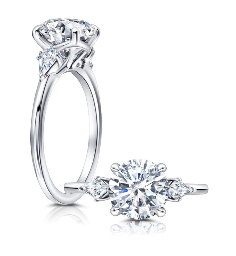 Classic Three Stone Engagement Ring Featuring Two Kite Diamonds