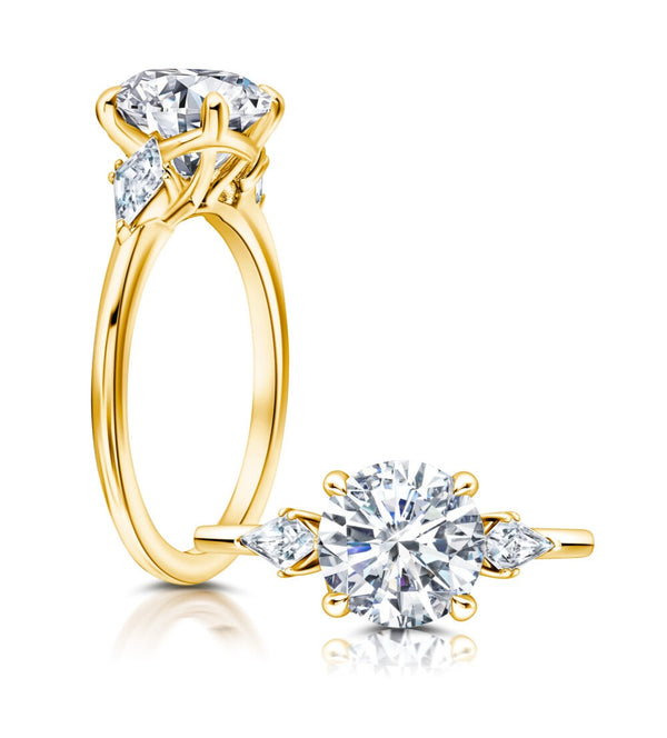 Classic Three Stone Engagement Ring Featuring Two Kite Diamonds